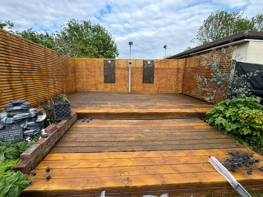 Restored timber decking with slatted privacy fencing